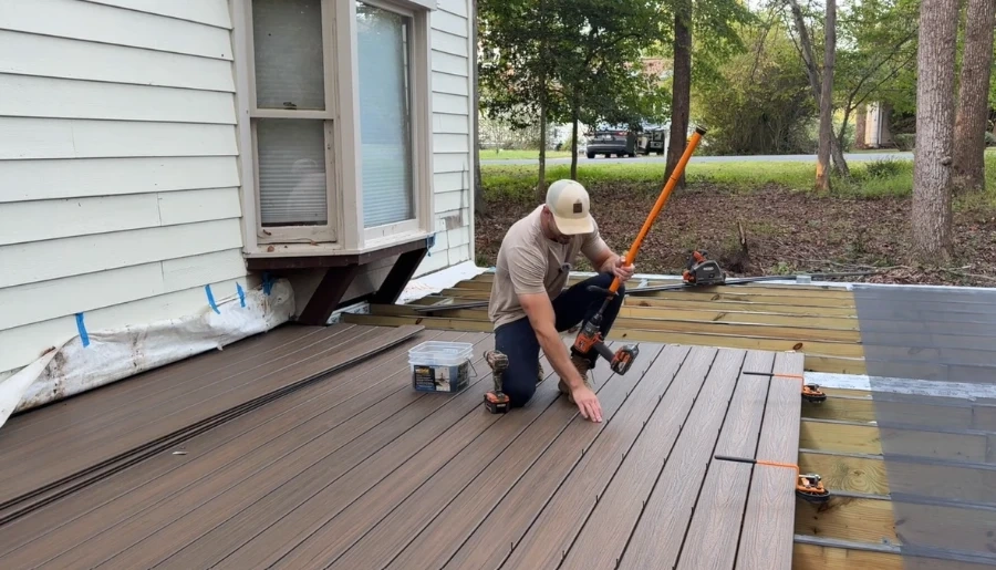 Installing brown composite deck boards on a Knoxville, TN home